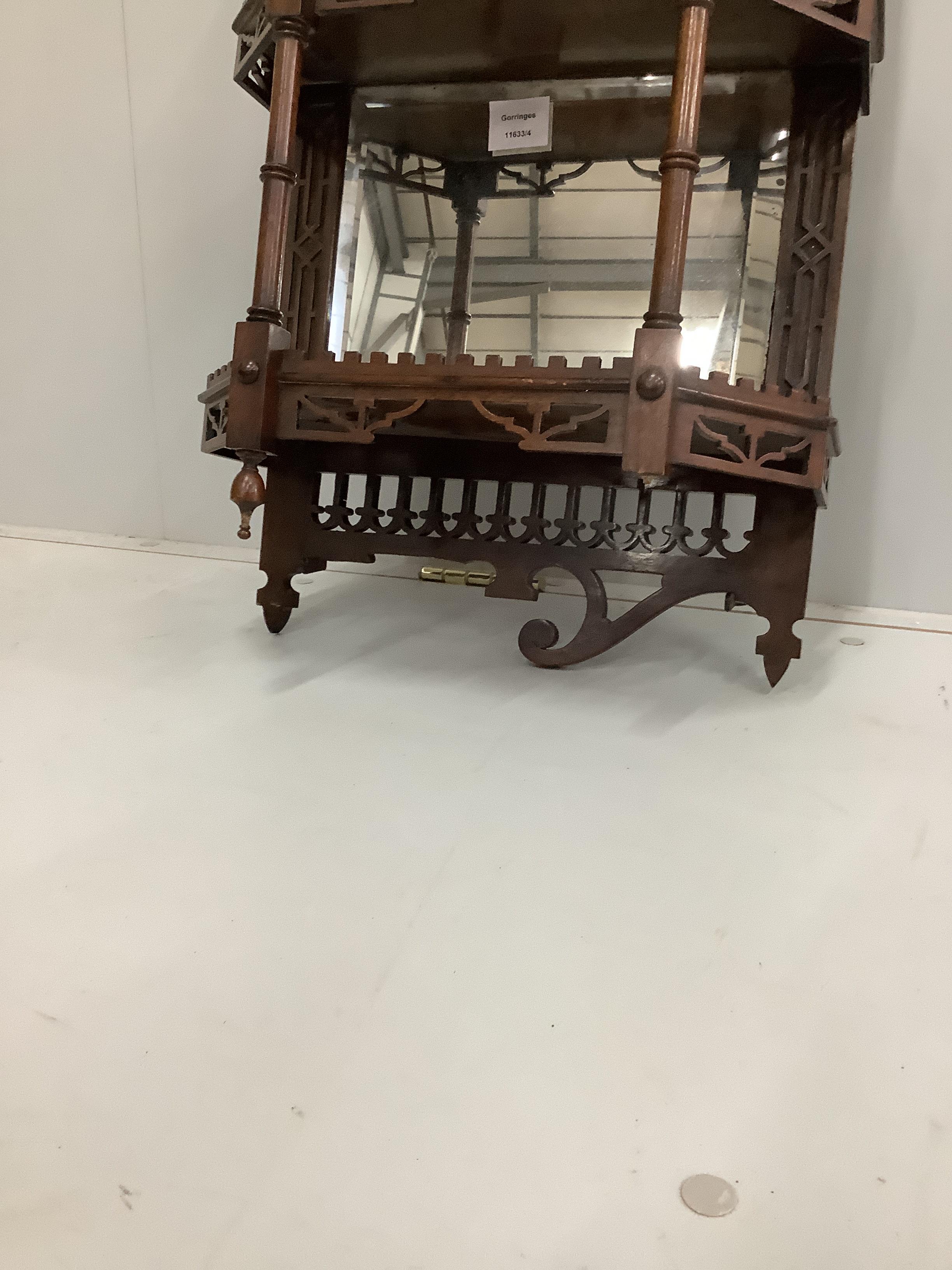 A late Victorian mahogany three tier mirrored wall bracket, width 40cm, height 76cm